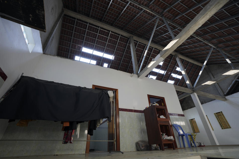 A roof of a nearby residence is seen damaged after an ammunition explosion at Prey Beng village in Kampong Speu province, Cambodia, Sunday, April 28, 2024. An ammunition explosion at a base in southwestern Cambodia on Saturday afternoon killed multiple soldiers and wounded several others, Prime Minister Hun Manet said. (AP Photo/Heng Sinith)