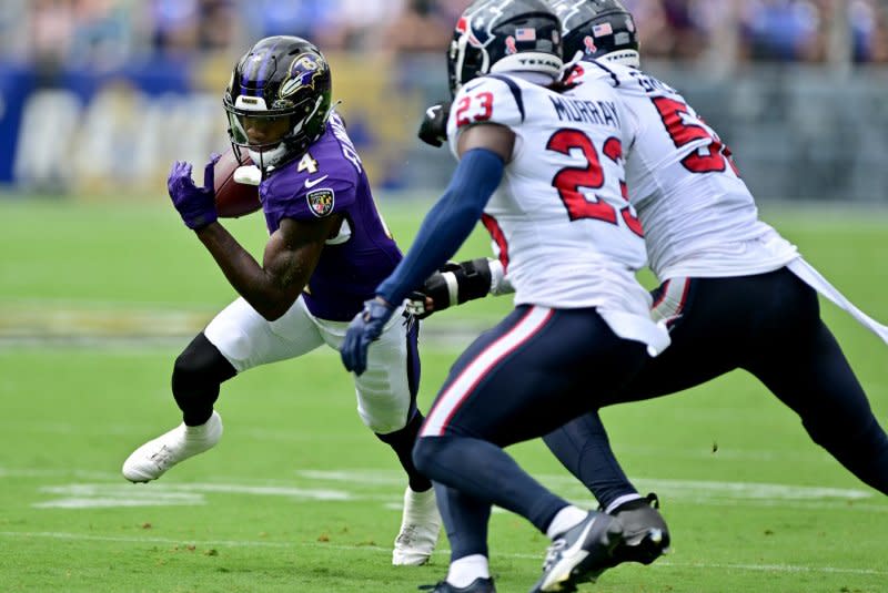 Baltimore Ravens wide receiver Zay Flowers (L) runs for short yardage against the Houston Texans on Sunday at M&ampT Bank Stadium in Baltimore. Photo by David Tulis/UPI