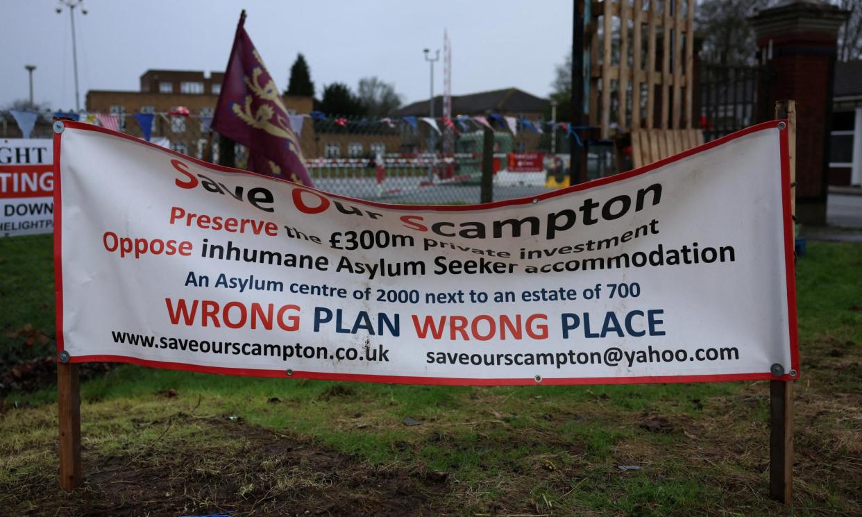 <span>A banner at a protest camp outside the main gate of RAF Scampton. Ground gases and unexploded ordnance have been found on the site.</span><span>Photograph: Phil Noble/Reuters</span>