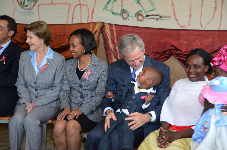 First lady Laura Bush and President George W. Bush at a PEPFAR site in Ethiopia in 2011. (PEPFAR)