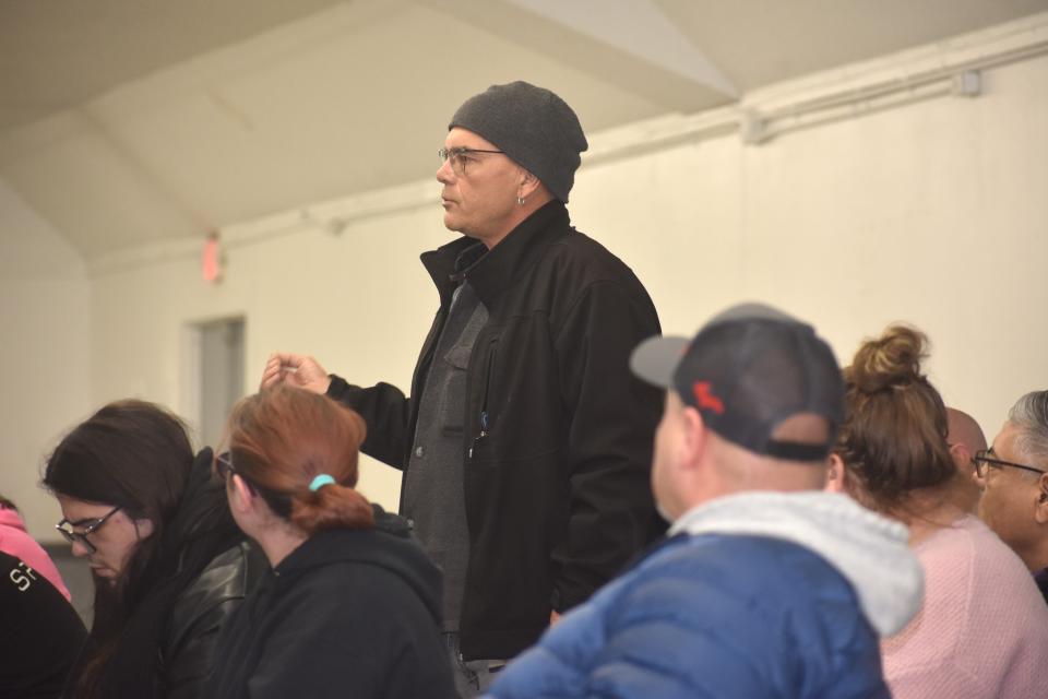 Adrian resident and business owner Jim Bundshuh, standing, was one of at least 50 east side Adrian residents to attend a public meeting Monday, Feb. 12, 2024, with the Adrian City Commission that sought to develop ideas for the best ways to spend $100,000 in grand funds from the Crimson Holdings, LLC, egg processing facility.