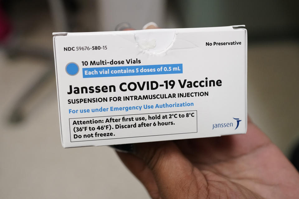 Sharis Carr, a nurse at the Aaron E. Henry Community Health Service Center in Clarksdale, Miss., holds a box containing doses of the Johnson & Johnson COVID-19 vaccine Wednesday, April 7, 2021. The U.S. is recommending a “pause” in using the single-dose Johnson & Johnson COVID-19 vaccine to investigate reports of potentially dangerous blood clots. (AP Photo/Rogelio V. Solis)