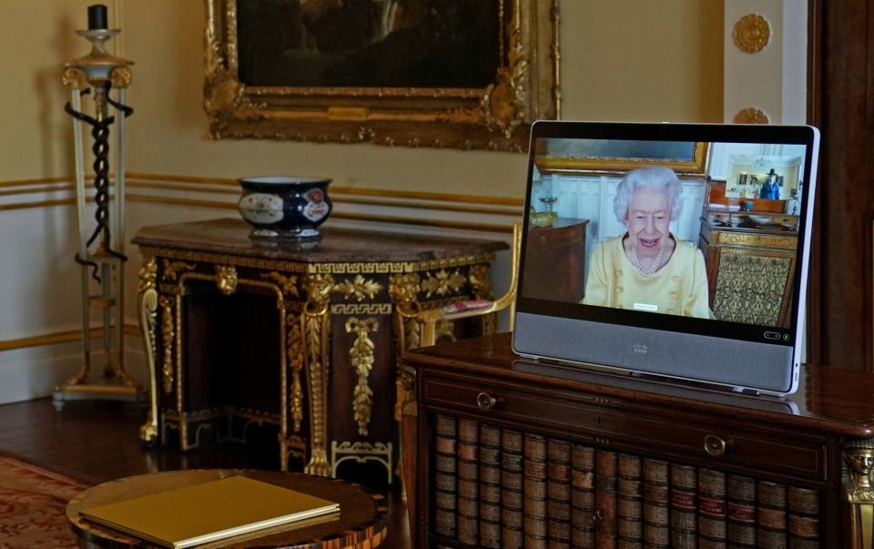 Britain's Queen Elizabeth appears on a screen via video link from Windsor Castle - Pool/Reuters