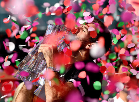 Mar 18, 2018; Indian Wells, CA, USA; Juan Martin Del Potro holds the championship trophy after defeating Roger Federer (not pictured) in the men's finals in the BNP Paribas Open at the Indian Wells Tennis Garden. Mandatory Credit: Jayne Kamin-Oncea-USA TODAY Sports