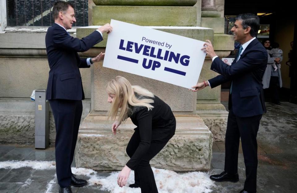 ‘Yeah, not that far up’: Jeremy Hunt and Rishi Sunak hold a ‘levelling up’ sign above the MP Sara Britcliffe