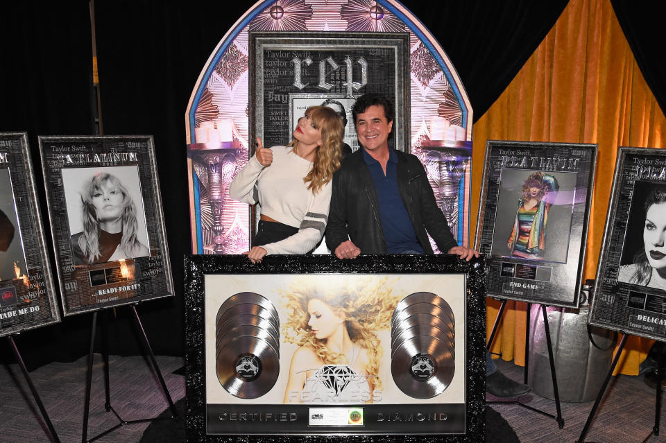 EAST RUTHERFORD, NJ - JULY 21:  Taylor Swift (L) and  CEO of Big Machine Records Scott Borchetta plaque presentation backstage at the Taylor Swift reputation Stadium Tour at MetLife Stadium on July 21, 2018 in East Rutherford, New Jersey.  (Photo by Kevin Mazur/TAS18/Getty Images for TAS)