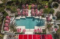 <p>What do you get when you bring in acclaimed director Baz Luhrmann and his partner in life and costume design, Catherine Martin, to design a luxury hotel in Miami? A one-of-a-kind, retro-chic property with an abundance of theatrical details. Just like Luhrmann's movies and Martin's costumes, <a href="https://www.faena.com/miami-beach" rel="nofollow noopener" target="_blank" data-ylk="slk:Faena Hotel Miami Beach;elm:context_link;itc:0;sec:content-canvas" class="link ">Faena Hotel Miami Beach</a> is larger-than-life, full of color, and utterly unforgettable. Plus, each floor features luxe amenities, like 24-hour butler service, a 22,000-square-foot spa, and two of the city's hottest restaurants. </p>