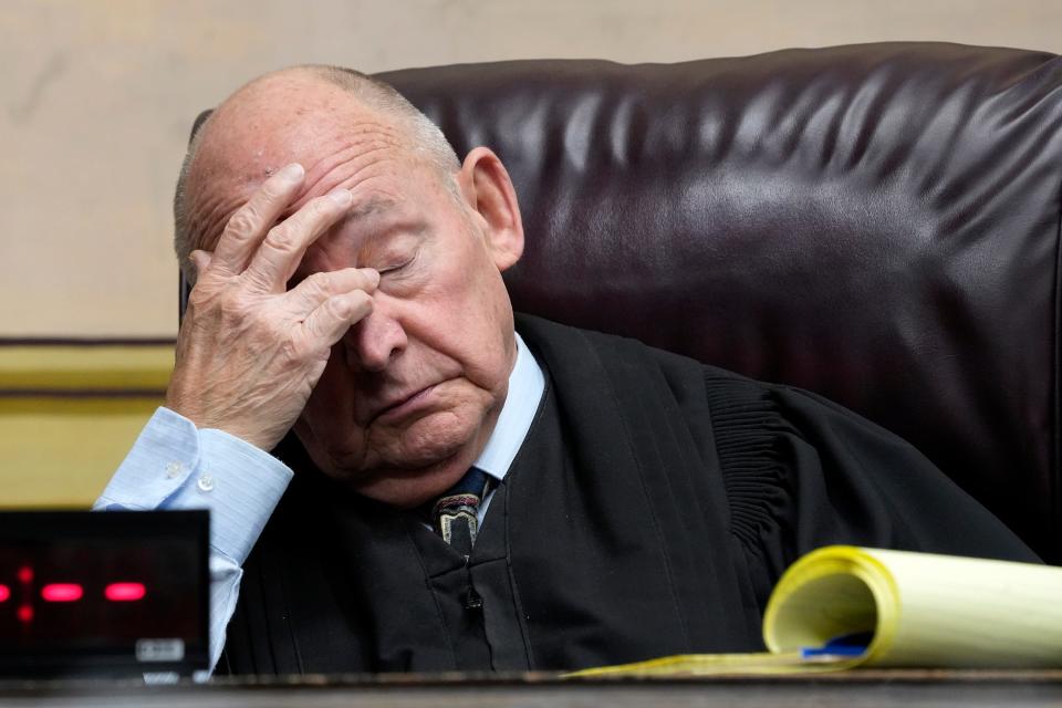Judge Randy Deering rubs his eyes while Edward "Jake" Wagner testifies. The trial of George Washington Wagner IV resumes Friday, October 27, 2022 at the Pike County Common Pleas Court in Waverly, Ohio. Eight members of the Rhoden family were found shot to death at four different locations on April 21-22, 2016.