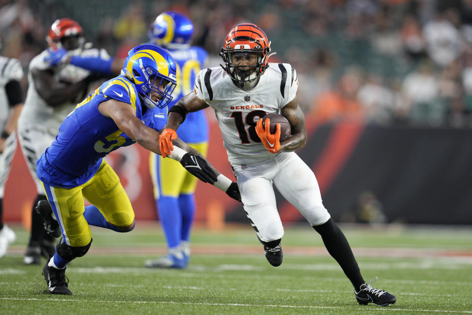 Cincinnati Bengals wide receiver Kwamie Lassiter II (18) runs after a catch against the Los Angeles Rams during the second half of a preseason NFL football game in Cincinnati, Saturday, Aug. 27, 2022. (AP Photo/Jeff Dean)