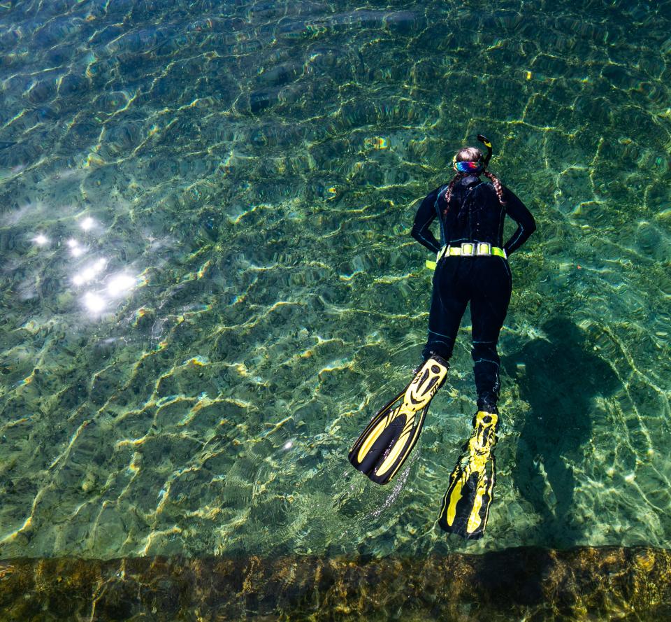 A snorkeler swims in Salt Springs as patrons used the Salt Springs Recreation area Saturday afternoon, October 23, in Salt Springs, FL. Recreational use has caused the vegetation in the spring bottom to be trampled, killing the grass that some fish feed on.