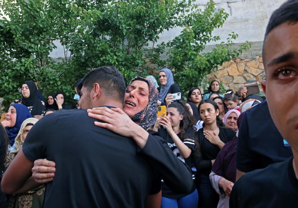 Mourners react during the funeral of Mohammad Kiwan, a 17-year-old Palestinian who succumbed to his wounds after being shot during confrontations with Israeli troops last week.