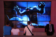 BERLIN, GERMANY - AUGUST 31: Visitors watch a 3D film trailer on a composite television screen at the Grundig stand during the Internationale Funkausstellung (IFA) 2012 consumer electronics trade fair on August 31, 2012 in Berlin, Germany. Microsoft, Samsung, Sony, Panasonic and Philips are amongst many of the brands showcasing their latest consumer electronics hardware, software and gadgets to members of the public from August 31 to September 5. (Photo by Adam Berry/Getty Images)