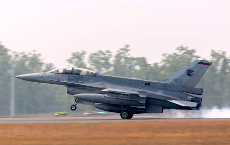 A supplied photo shows a Singapore Air Force F-16 plane landing as it arrives ahead of Exercise Pitch Black 2018 at the Royal Australian Air Force (RAAF) Base in Darwin, Australia, July 24, 2018. Australian Defence Force/Handout via REUTERS