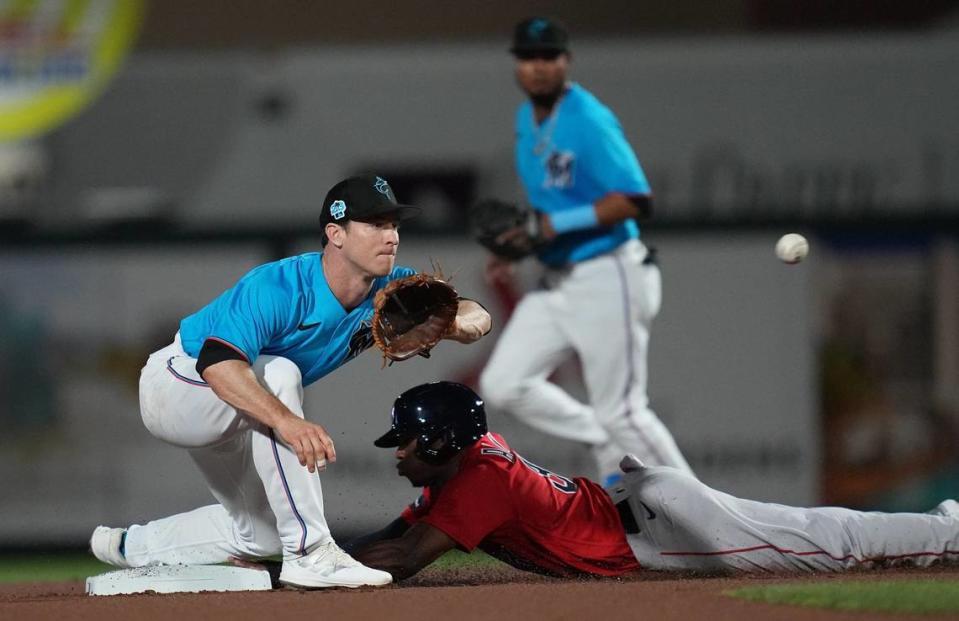 Boston Red Sox left fielder Greg Allen (31) steals second base as Miami Marlins shortstop Joey Wendle (18) covers on the play in the first inning at Roger Dean Stadium on Feb 28, 2023 in Jupiter, Florida.