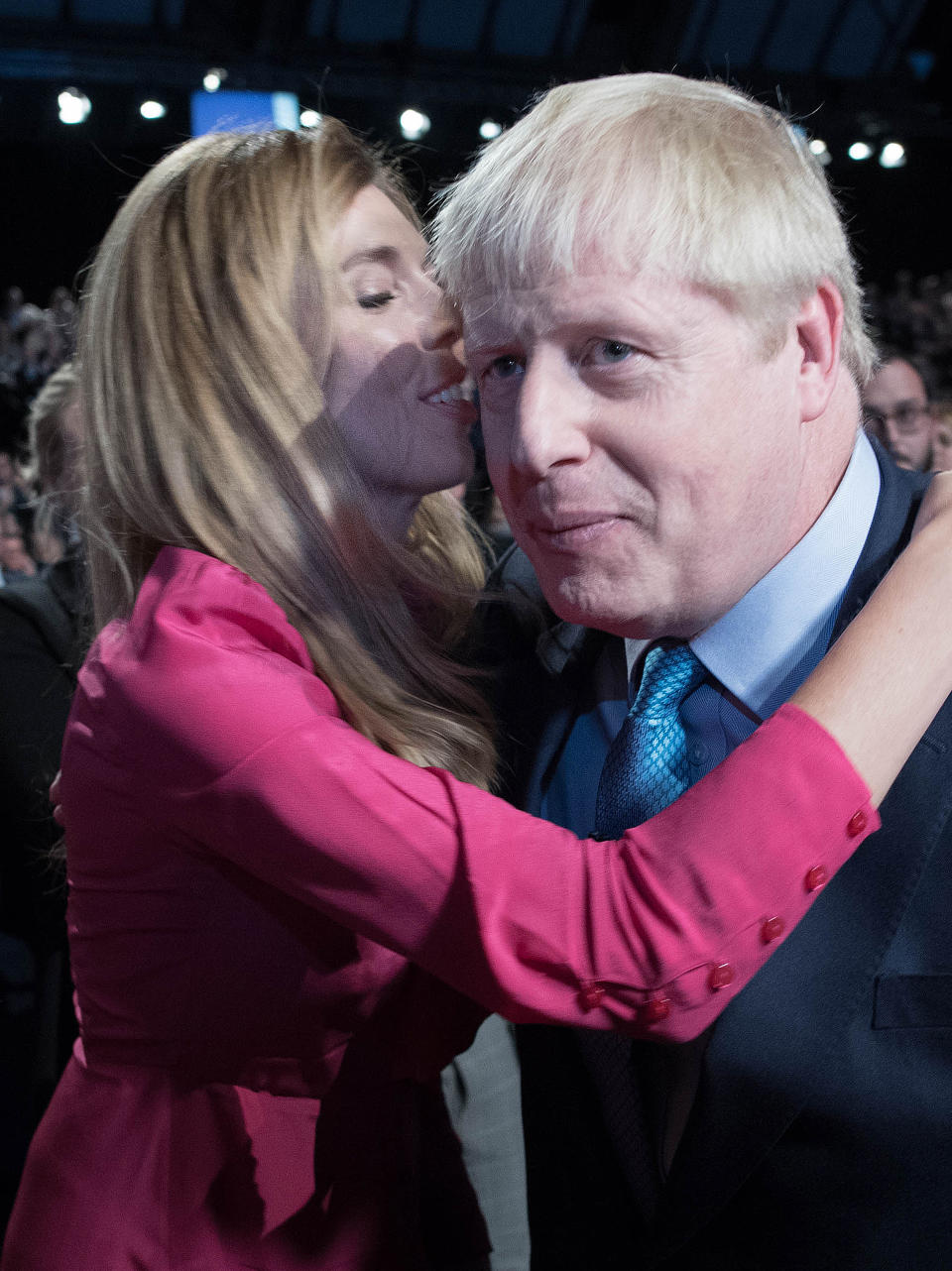 Prime Minister Boris Johnson is kissed by his partner his partner Carrie Symonds, after delivering his speech during the Conservative Party Conference at the Manchester Convention Centre.