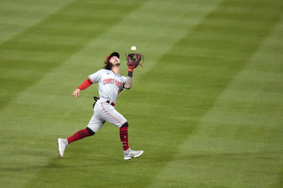 Cincinnati Reds second baseman Jonathan India catches a fly ball by St. Louis Cardinals' Yadier Molina during the sixth inning of a baseball game Friday, June 4, 2021, in St. Louis. (AP Photo/Jeff Roberson)