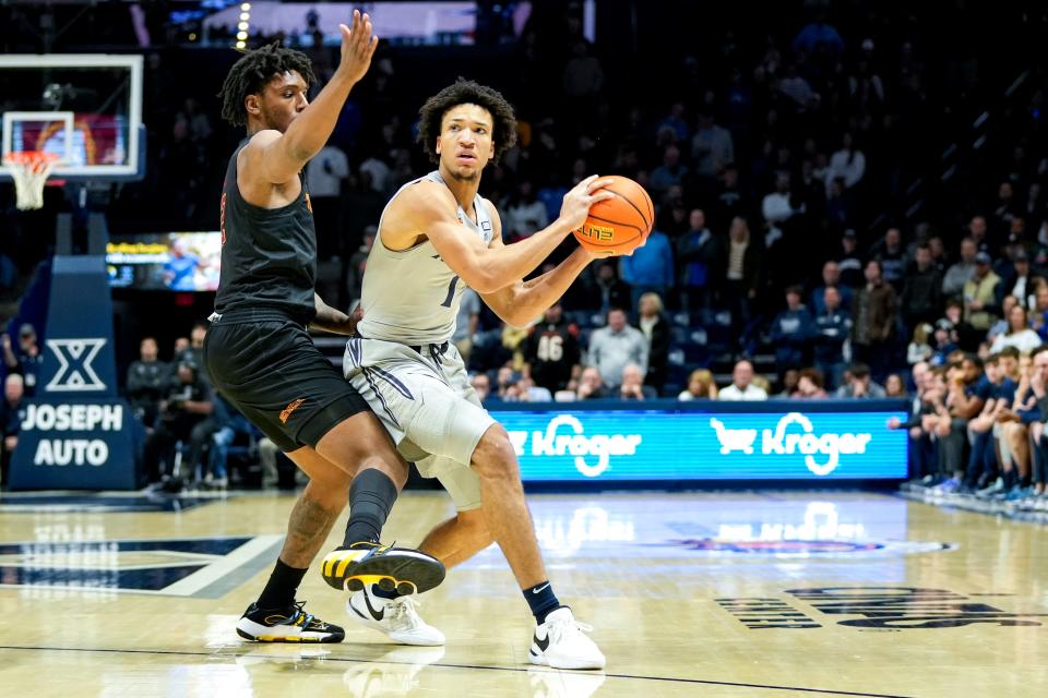 Xavier Musketeers guard Desmond Claude (1) looks to pass the ball in the first half of the NCAA basketball game between the Winthrop Eagles and Xavier Musketeers on Saturday, Dec. 16, 2023, at the Cintas Center in Cincinnati.