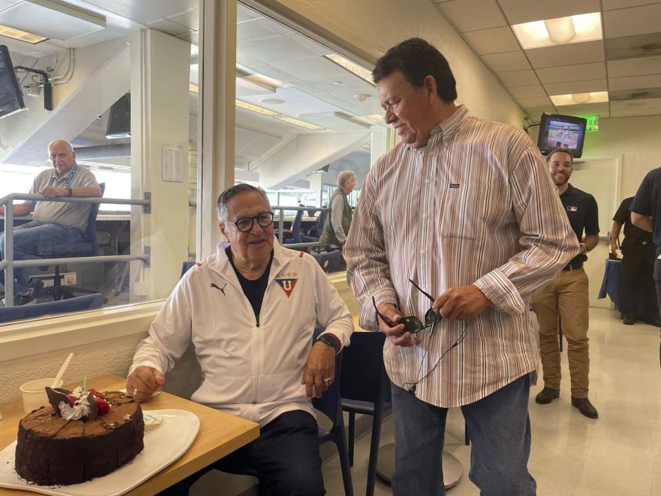 Dodgers Spanish-language broadcaster Jaime Jarrin, left, talks to Valenzuela before a game on Oct. 5, 2022.