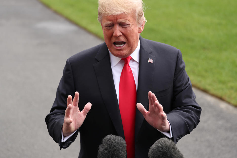 President Trump talks to reporters as he departs the White House in Washington on Monday. (Photo: Jonathan Ernst/Reuters)