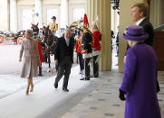 Britain's Queen Elizabeth II, foreground, and Netherlands' King Willem-Alexander, wait for Queen Maxima and Prince Charles upon their arrival at Buckingham Palace, in London, Tuesday, Oct. 23, 2018. The Dutch king and queen began a state visit to Britain that will include full ceremonial honors. (Peter Nicholls/Pool Photo via AP)