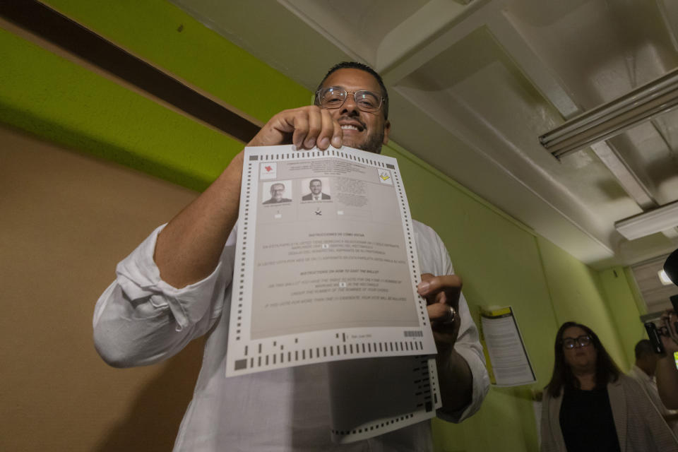 Rep. Jesús Manuel Ortiz shows his ballot during the gubernatorial primaries in San Juan, Puerto Rico, Sunday, June 2, 2024. Ortiz hopes to be the main candidate for the Popular Democratic Party, which supports the island’s status quo as U.S. territory. (AP Photo/Alejandro Granadillo)