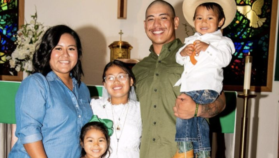Pictured are Crystal Flores (left) and Alex Jaramillo (second right) with children.