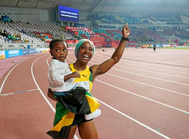 PHOTO: In this Sept. 29, 2019, file photo, Shelly-Ann Fraser-Pryce, of Jamaica, holds her son, Zyon, after winning the women's 100-meter final at the World Athletics Championships in Doha, Qatar. (David J. Phillip/AP, FILE)