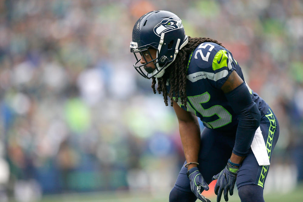 Seattle Seahawks offensive tackle Tommy Champion stretches during