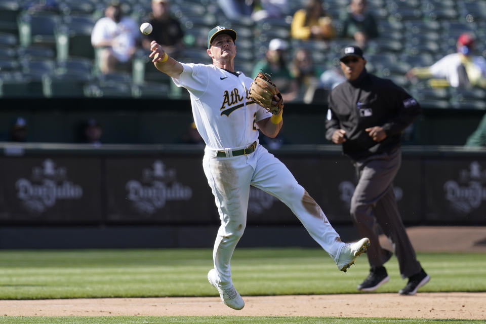 Oakland Athletics third baseman Matt Chapman throws out Minnesota Twins' Jorge Polanco during the fourth inning of the first baseball game of a doubleheader in Oakland, Calif., Tuesday, April 20, 2021. (AP Photo/Jeff Chiu)
