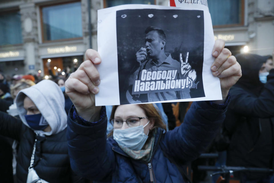 A activist holds a poster reading "Freedom for Navalny!" during the opposition rally in support of jailed opposition leader Alexei Navalny in Moscow, Russia, Wednesday, April 21, 2021. Police across Russia have arrested more than 180 people in connection with demonstrations in support of imprisoned opposition leader Alexei Navalny, according to a human rights group. (AP Photo/Pavel Golovkin)