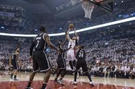 Toronto Raptors' Jonas Valanciunas shoots against the Brooklyn Nets during the first half of Game 1 of an opening-round NBA basketball playoff series, in Toronto on Saturday, April 19, 2014. (AP Photo/The Canadian Press, Chris Young)