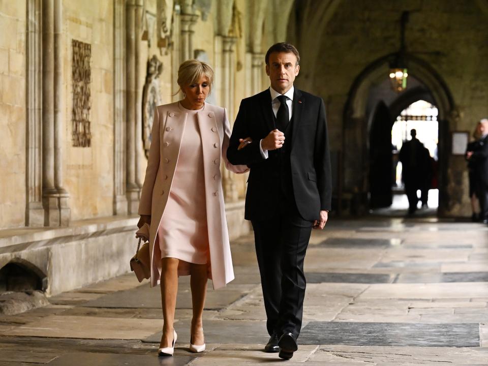 Emmanuel Macron and his wife Brigitte Macron arrive at the coronation
