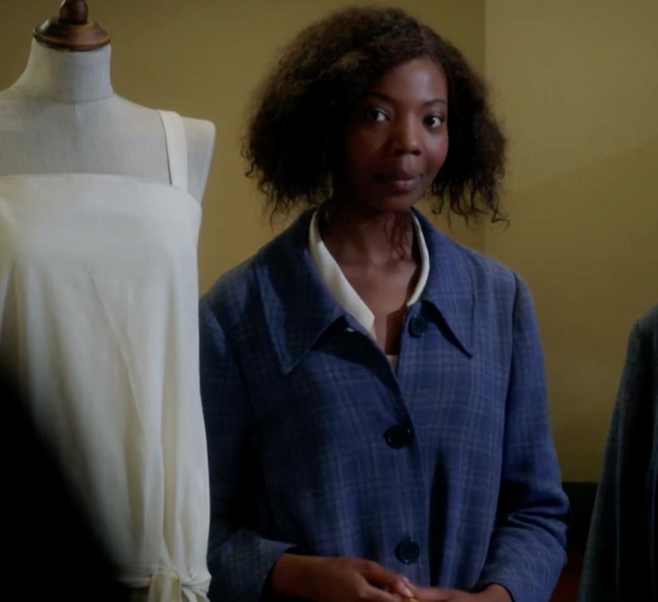 Mimi Ndiweni as Tilly, a seamstress, answers a question proposed by Lady Mae in "Mr Selfridge"