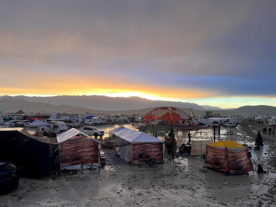 Tents between puddles and mud on the grounds of the "Burning Man" festival.