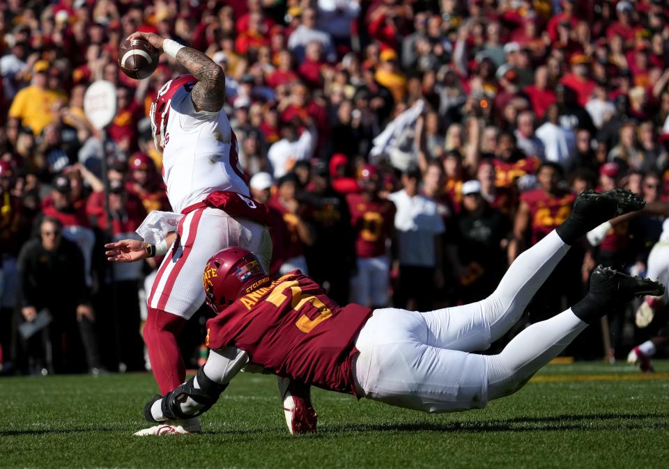 Iowa State defensive end MJ Anderson (3) sacks OU quarterback Dillon Gabriel during the fourth quarter of Saturday's game in Ames.