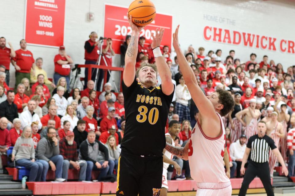 The College of Wooster's JJ Cline gets up a shot during the Scots' 74-65 loss to Wabash in the NCAC Tournament title game.