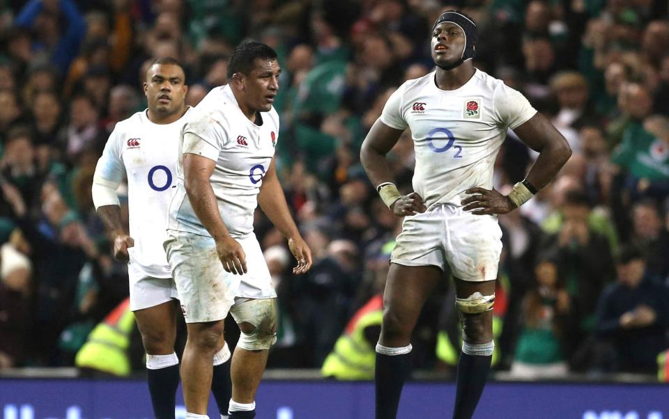 England's Billy Vunipola, left and teammate England's Maro Itoje react after the final whistle following the Six Nations rugby union international match between Ireland and England at the Aviva stadium in Dublin, Ireland - AP