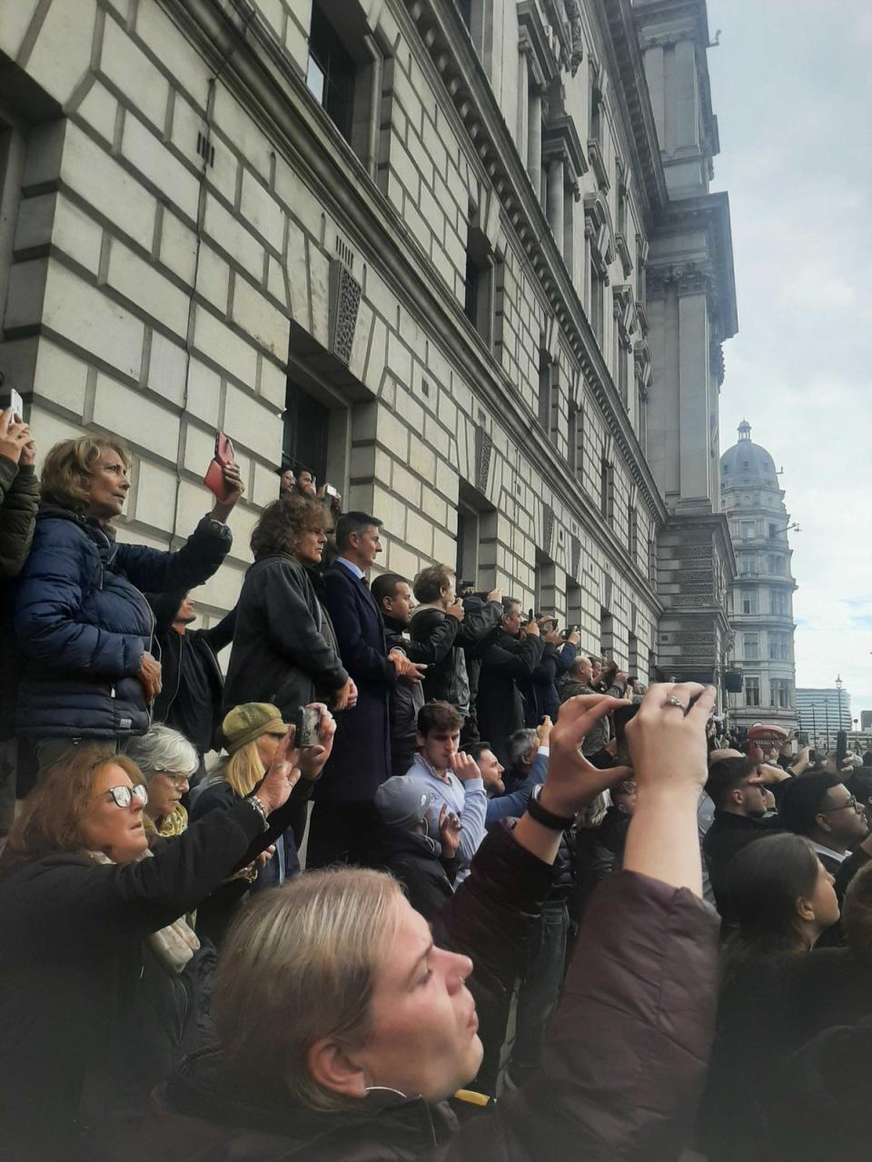 Mourners try to catch a glimpse of the Queen’s coffin on the way to the state funeral (Zoe Tidman / The Independent)
