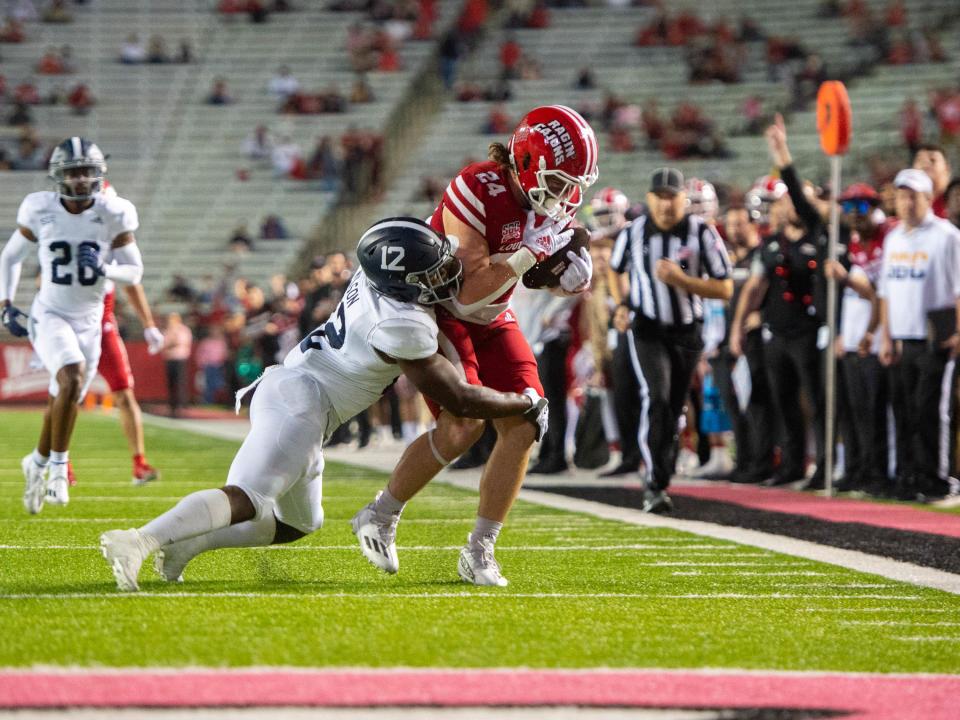 Louisiana Ragin' Cajuns tight end Pearse Migl (24) makes a catch as Georgia Southern safety Anthony Wilson (12) makes the tackle Nov. 10, 2022, at Cajun Field in Lafayette, Louisiana.