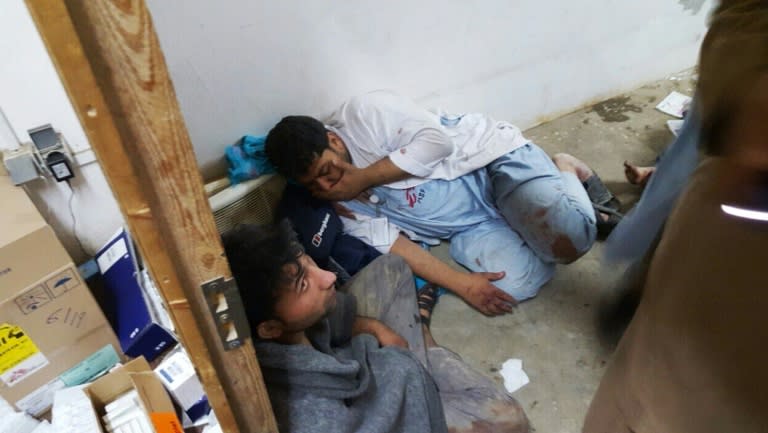 Afghan MSF staff in one of the remaining parts of the MSF hospital in Kunduz after it was hit by an air strike