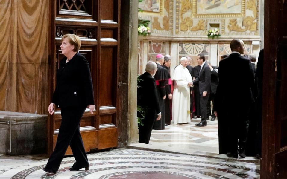 Merkel leaves a meeting with the Pope on Friday - REUTERS
