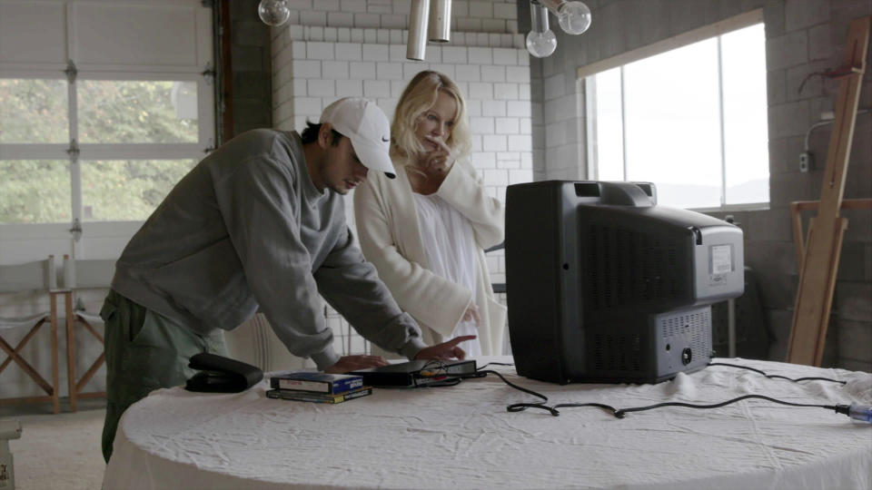This image released by Netflix shows Pamela Anderson, right, and her son Brandon Thomas Lee in a scene from the documentary "Pamela, A Love Story." (Netflix via AP)