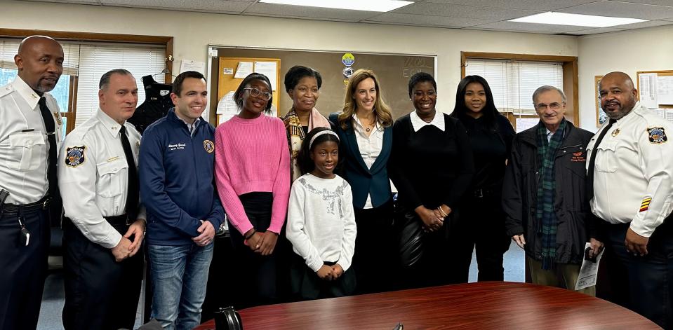 Bobbi Wilson of Caldwell, foreground was honored in Montclair. Left to right: Montclair Deputy Police Chief Wilhelm Young, Chief Todd Conforti, Attorney General of New Jersey Matt Platkin, Bobbi's sister Hayden and aunt, Congresswoman Mikie Sherrill, Monique Joseph, mother of Bobbi Wilson, Officer Erica Peterson, Councilor Bob Russo, Lt. Tyrone Williams Jr. January 13, 2023.