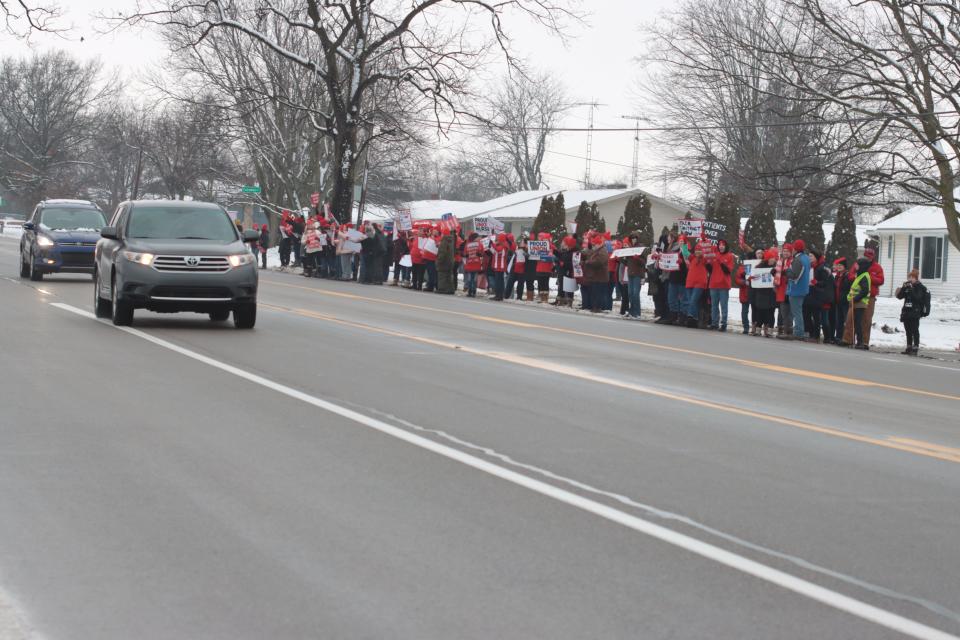 Members of the Michigan Nurses Association local at ProMedica Hickman Hospital stage a "practice strike" Tuesday across M-52 from the hospital.