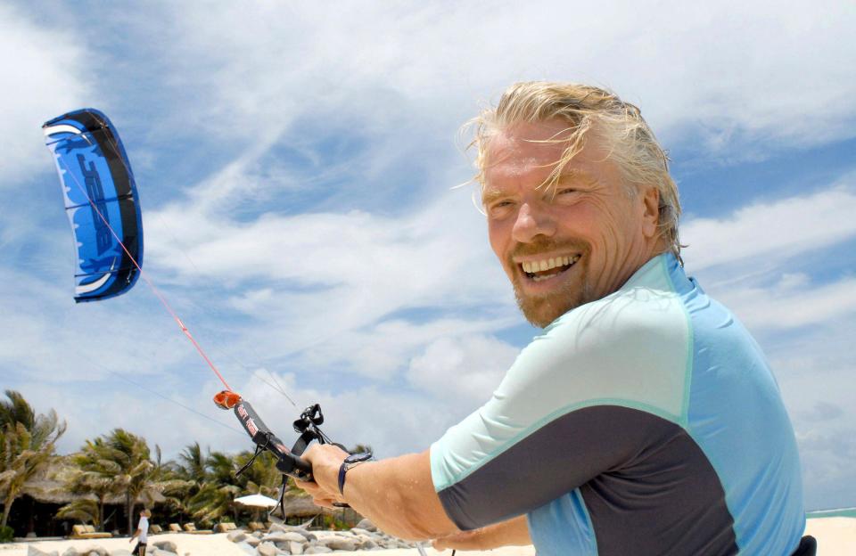 Richard Branson prepares to go kite-boarding near his private resort and home, on Necker Island, British Virgin Islands, Sunday, June 8, 2008. Branson, a high school dropout who built his Virgin empire into a world brand, said he plans for his newest property, nearby Mosquito Island, to be transformed into what he touts as the most environmentally-friendly resort on the globe. (AP Photo/Todd VanSickle)