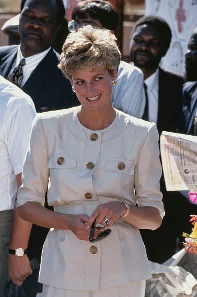 <div class="inline-image__caption"><p>Diana visits the Nemazuva Child feeding centre near Masvingo in Zimbabwe, to see the work done by the Zimbabwe Red Cross, 12th July 1993. She is wearing a safari suit by Catherine Walker.</p></div> <div class="inline-image__credit">Princess Diana Archive</div>