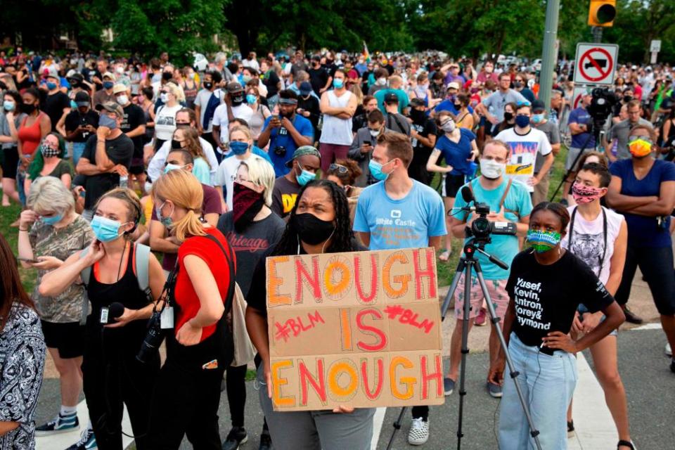 People watch as the Stonewall Jackson statue is removed from Monument Avenue in Richmond, Virginia, on 1 July 1.