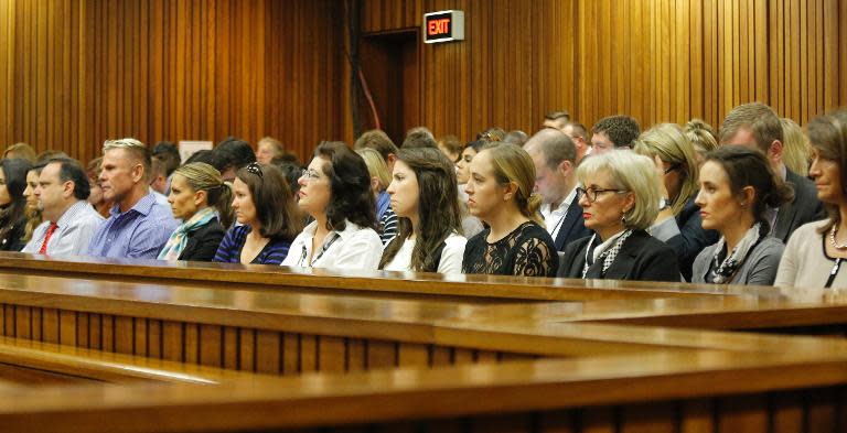 Oscar Pistorius's family sits and watches his testimony in Pretoria on April 14, 2014