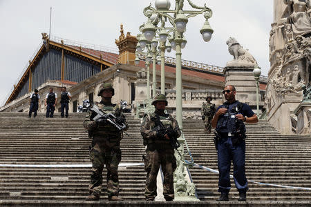 French soldiers and police secure the Gare Saint Charles train station which was evacuated after an alert in Marseille, France, May 19, 2018. REUTERS/Philippe Laurenson