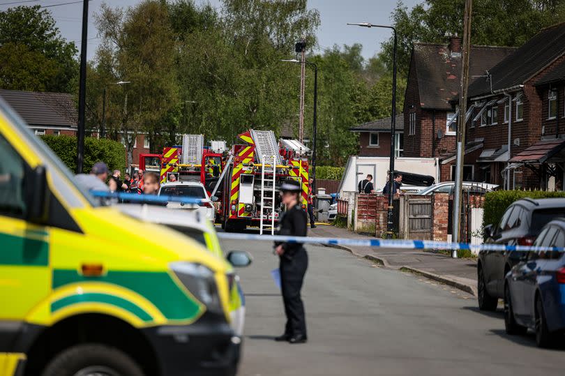 Emergency services at the scene of a house fire in Partington